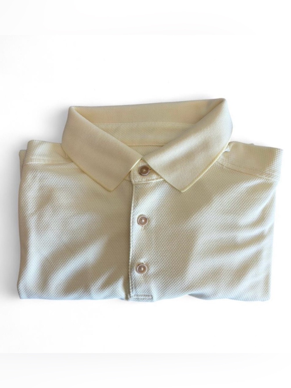 Tommy Bahama light buttery yellow polo shirt in Size L. Lightly textured.